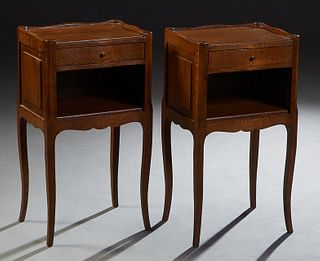 Pair of French Provincial Louis XV Style Carved Oak Nightstands, early 20th c, the 3/4 dished top over a serpentine frieze drawer, on tapered square c