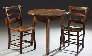 Three Pieces of French Provincial Furniture, late 19th c., consisting of a circular pine table with a triangular skirt, on triangular splayed legs; an