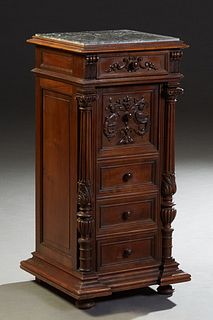 French Henri II Style Carved Walnut Marble Top Nightstand, c. 1880, the inset highly figured gray marble over a frieze drawer, a fall front pot cupboa