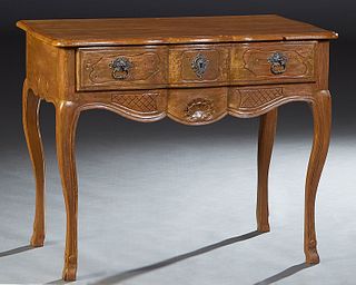 French Carved Walnut Bowfront Dressing Table, early 20th c., the stepped serpentine rounded edge top over a long frieze drawer, on scrolled cabriole l