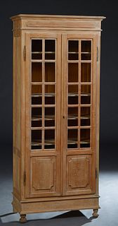Diminutive French Carved Beech Bookcase, c. 1870, the stepped ogee crown over double doors with upper glazed mullioned panels, over lower incised fiel