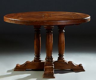French Provincial Carved Oak Farmhouse Table, 19th c., the 2 1/2 inch think parquetry inlaid circular top on four turned tapered columnar supports, on