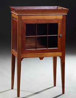 French Louis Philippe Style Carved Cherry Bar Cabinet, early 20th c., with a removable tray top over a mullioned glazed door flanked by fielded panel 