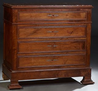 French Louis Philippe Carved Walnut Marble Top Commode, 19th c., the inset highly figured brown marble over a frieze drawer and three deep drawers, on