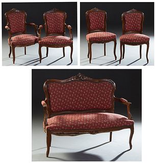 French Carved Beech Louis XV Style Parlor Suite, early 20th c., consisting of a settee, 2 fauteuils and 2 side chairs, the arched floral and C-scroll 