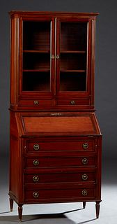 French Louis XVI Style Carved Mahogany Secretary Bookcase, 20th c., the ogee crown over double glazed doors above shallow drawers, on a base with a sl