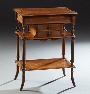 French Carved Mahogany Work Table, 19th c., the shaped lifting lid with an interior beveled mirror and compartmented storage, over two small central d