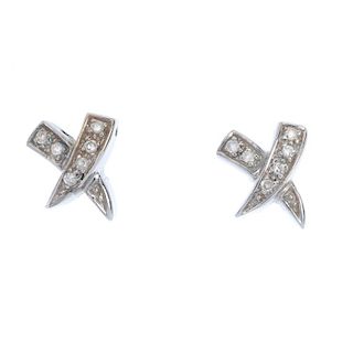 A selection of diamond jewellery. To include a pair of cross ear studs, a 9ct gold cross pendant, to