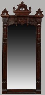 American Eastlake Carved Walnut Overmantel Mirror, c. 1890, the roundel mounted crest over an arched plate flanked by turned engaged columns, H.- 55 i