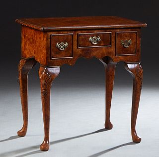 English Inlaid Burled Walnut Lowboy, 20th c., the stepped canted corner top over three frieze drawers, on cabriole legs with carved knees and pad feet