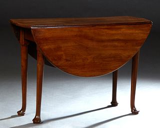 English Georgian Carved Mahogany Gateleg Demi-Lune Table, early 19th c., the circular top over a wide skirt, on cabriole legs, H.- 28 1/2 in., W.- 42 