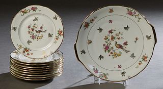 French Limoges Eleven Piece Dessert Set, 20th c., by Veritable Porcelaine, consisting of ten circular plates and a serving platter, with gilt rims aro