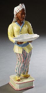 Italian Porcelain Figural Nubian Calling Card Tray, 20th c., the tignon topped female holding a large shell, on an integral canted corner stepped squa
