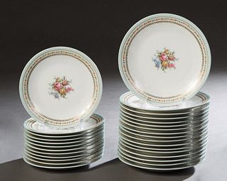 French Twenty-Nine Piece Limoges Partial Dinner Service, 20th c., by Raynaud, with a pale blue border around floral decoration and gilt tracery, consi