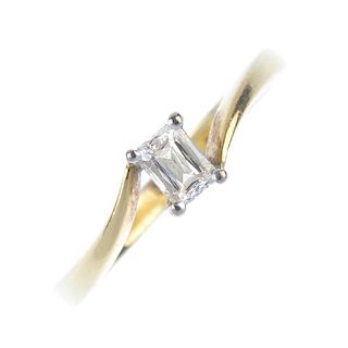 An 18ct gold diamond single-stone ring. The rectangular-shape diamond, to the asymmetric shoulders a