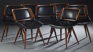 Set of Seven Mid Century Modern Style Dining Chairs, with laminated backs and faux leather back cushions and seats, on tapered cylindrical splayed leg