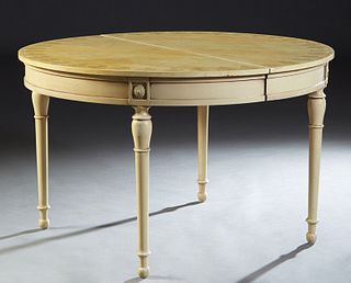 French Louis XVI Style Polychromed Beech Dining Table, 20th c., the circular top with leaf and bow decoration, over a wide skirt, on turned tapered cy