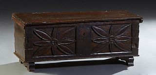 Diminutive French Provincial Carved Oak Coffer, 19th c., single board lift top over a floral carved front panel, on ogee block feet, H.- 15 3/4 in., W