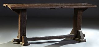 French Provincial Carved Oak Farmhouse Table, 19th c., three board top on large block trestle supports, joined by a large square stretcher. H.- 32 in.