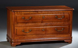 French Provincial Louis Philippe Carved Cherry Commode, 19th c., the rounded edge and corner top over two deep drawers, on a plinth base with bracket 