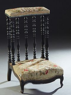 French Ebonized Carved Beech Louis XV Style Prie Dieu, c. 1870, the padded armrest on six turned tapered supports to a bowfront kneeler, in original r