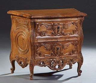 Diminutive French Provincial Style Bombe Carved Commode, 21st c., the stepped edge serpentine bowfront top over two graduated drawers, flanked by carv