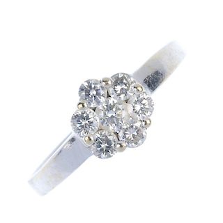 A diamond ring and pendant. The ring designed as a brilliant-cut diamond floral cluster ring, the pe
