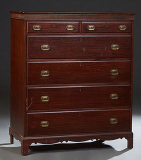 American Carved Mahogany Chest, 20th c., the stepped rectangular top over a reeded frieze above two frieze drawers and four graduated deep drawers, on