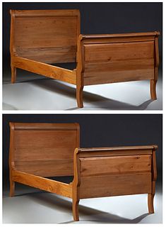 Pair of Carved Cypress Single Sleigh Beds, 20th c., with curved scrolled head and footboards, H.- 43 in., Int. W.- 40 in., Int. D.- 73 in.