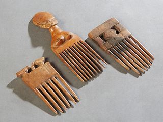Group of Three African Carved Wooden Combs, early 20th c., one topped by a carved woman's head, one by two birds; and one with pierced incised decorat