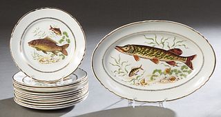 Thirteen Piece French Ceramic Fish Set, 20th c., by Orchies, Moulin de Loup, consisting of 12 circular fish plates and an oval platter, with transfer 