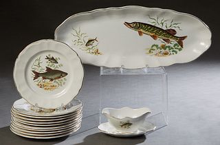 French Thirteen Piece Ceramic Fish Set, 20th c., by KG, Luneville, consisting of 11 plates, a sauce boat on integral flat, and a large oval platter, a