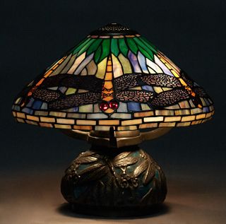 Tiffany Style Leaded Glass Dragonfly Lamp, 20th/21st c., the dragonfly shade on an enameled dragonfly baluster base with relief decoration, H.- 16 in.