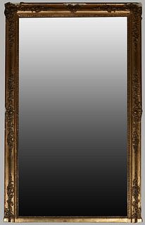 French Gilt and Gesso Overmantel Louis XV Style Mirror, late 19th c., pine with a wide relief floral and berry mounted rounded frame. H.- 68 1/2 in., 