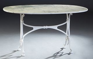 Parisian Marble and Wrought Iron Bistro Table, 20th c., the oval highly figured beige marble on iron trestle bases, joined by an X-form stretcher, H.-