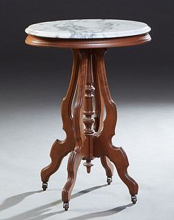 American Carved Walnut Marble Top Lamp Table, early 20th c., stepped ogee edge white marble over a reeded figural skirt on four cabriole legs around a