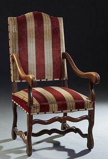 French Carved Beech Fauteuil a la Reine, 20th c., arched canted high upholstered back over scrolled arms and a cushioned seat on cabriole legs, joined