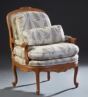 French Louis XV Style Carved Mahogany Oversized Fauteuil, 20th c., the shell carved arched canted upholstered back over upholstered arms and a removab