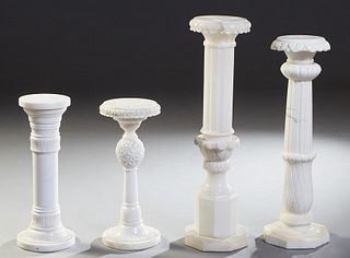 Group of Four Carved Alabaster Pedestals, 20th c., consisting of two tall examples with circular tops and reeded sides to hexagonal bases; two short e