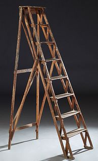 French Carved Beech Folding Ladder, early 20th c., with seven steps. H.- 69 1/2 in., W.- 19 1/2 in., D.- 35 in.