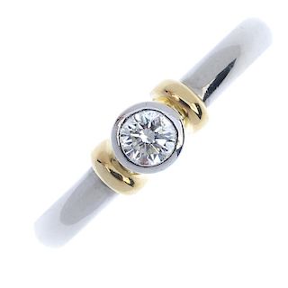 A platinum diamond single-stone ring. The brilliant-cut diamond collet, to the bi-colour bar shoulde