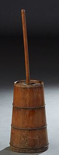 Primitive Carved Pine Butter Churn, late 19th c., of tapered form with iron banding, H.- 18 1/4 in., Dia.- 10 in., Stirrer- H.- 35 3/4 in.
