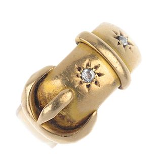 An early 20th century 18ct gold diamond dress ring. Designed as a buckle, with old-cut diamond highl
