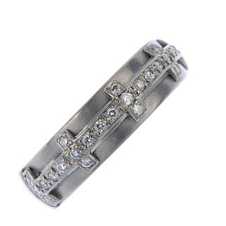 An 18ct gold diamond band ring. The brilliant-cut diamond line, with similarly-cut diamond bar space