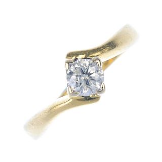 An 18ct gold diamond single-stone ring. The brilliant-cut diamond, to the asymmetric shoulders. Diam