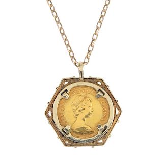A sovereign pendant. The sovereign, dated 1982, within a 9ct gold geometric surround, suspended from