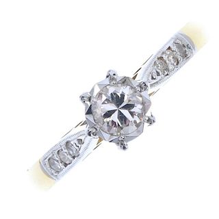 A diamond single-stone ring. Of bi-colour design, the brilliant-cut diamond, within an illusion moun