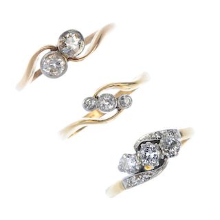 A selection of three early and mid 20th century gold diamond crossover rings. To include an early 20