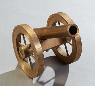 Bronze Ship's Signal Cannon, late 19th c., on spoked bronze wheels, the rear top with a touch hole for firing, H.- 10 in., W.- 7 3/4 in., D.- 13 in. (