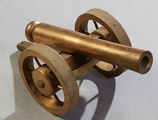 Small Bronze Ship's Signal Cannon, late 19th c., on spoked bronze wheels, the rear top with a touch hole for firing, H.- 5 in., W.- 5 3/8 in., D.- 12 